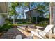 Relaxing brick patio with comfortable seating and lush landscaping at 4307 W Kensington Ave, Tampa, FL 33629