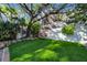Spacious backyard with putting green and mature trees at 4307 W Kensington Ave, Tampa, FL 33629