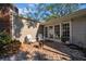 Enclosed brick patio with seating and access to the home at 4307 W Kensington Ave, Tampa, FL 33629