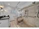 Spacious bathroom with walk-in shower and built-in seat at 4307 W Kensington Ave, Tampa, FL 33629