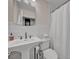 Modern bathroom with white subway tile and copper fixtures at 4307 W Kensington Ave, Tampa, FL 33629