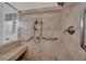 Walk-in shower with grab bars and built-in seat at 4307 W Kensington Ave, Tampa, FL 33629