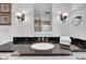Bathroom featuring dark granite countertop and undermount sink at 4307 W Kensington Ave, Tampa, FL 33629