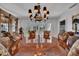 Elegant dining room with round table and chandelier at 4307 W Kensington Ave, Tampa, FL 33629