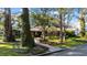 Landscaped yard with brick home and mature trees at 4307 W Kensington Ave, Tampa, FL 33629