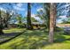 Landscaped yard with brick walkway and mature trees at 4307 W Kensington Ave, Tampa, FL 33629