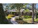 Brick home with landscaped yard and walkway at 4307 W Kensington Ave, Tampa, FL 33629