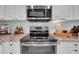 Stainless steel appliances and granite countertops in this kitchen at 4307 W Kensington Ave, Tampa, FL 33629