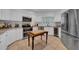Modern kitchen with stainless steel appliances and granite countertops at 4307 W Kensington Ave, Tampa, FL 33629