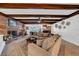 Spacious living room features a brick fireplace and exposed wooden beams at 4307 W Kensington Ave, Tampa, FL 33629