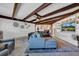 Living room with comfy sectional sofa and exposed beams at 4307 W Kensington Ave, Tampa, FL 33629