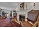 Living area featuring hardwood floors and fireplace at 4307 W Kensington Ave, Tampa, FL 33629
