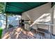Outdoor kitchen with stainless steel appliances and brick pavers at 4307 W Kensington Ave, Tampa, FL 33629