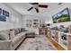 Playroom with sectional sofa and built in shelving at 4307 W Kensington Ave, Tampa, FL 33629