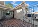 Side yard access with brick pavers and wrought iron gate at 4307 W Kensington Ave, Tampa, FL 33629