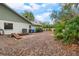 Large backyard with gravel, AC unit, and wooden beams at 4606 Ridgecliff Dr, Brandon, FL 33511