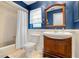 Bathroom with tub, toilet and wooden vanity at 4606 Ridgecliff Dr, Brandon, FL 33511