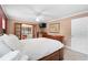 Main bedroom with wood furniture and access to sunroom at 4606 Ridgecliff Dr, Brandon, FL 33511