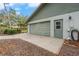 Attached garage with green door and large window at 4606 Ridgecliff Dr, Brandon, FL 33511