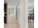 Long hallway with light walls and tiled flooring at 4606 Ridgecliff Dr, Brandon, FL 33511