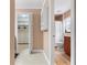 Hallway with built-in shelving and access to bathroom and closet at 4606 Ridgecliff Dr, Brandon, FL 33511