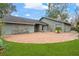 Front view of charming ranch house with brick walkway at 4606 Ridgecliff Dr, Brandon, FL 33511