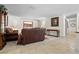 Open living room with tiled floors and a view into another room at 4606 Ridgecliff Dr, Brandon, FL 33511