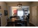 Bright dining area with dark wood table and chairs, and views into living room at 4713 Jennings Bay Ct, Tampa, FL 33611