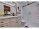 Bathroom with a glass enclosed shower and modern vanity at 4950 Gulf Blvd # 409, St Pete Beach, FL 33706