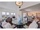 Open concept dining area with view into living room at 4950 Gulf Blvd # 409, St Pete Beach, FL 33706