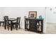 Welcoming entryway with black console table and seating at 5127 Chatsworth Ave, Tampa, FL 33625