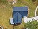 Overhead view of a house with a dark gray roof and a large grassy yard at 516 Highview N Cir, Brandon, FL 33510