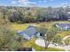 Aerial view showing a single story house on a large lot with mature trees nearby at 516 Highview N Cir, Brandon, FL 33510