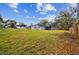 Spacious backyard with view of house and trees at 516 Highview N Cir, Brandon, FL 33510