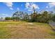 Open backyard with grassy area and fence at 516 Highview N Cir, Brandon, FL 33510
