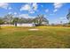 Large backyard with grassy area and partial house view at 516 Highview N Cir, Brandon, FL 33510