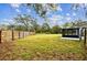 Large backyard with screened porch and wooden fence at 516 Highview N Cir, Brandon, FL 33510