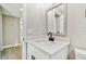 Modern bathroom vanity with white cabinets and quartz countertop at 516 Highview N Cir, Brandon, FL 33510