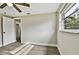 Bedroom with wood-look floors, ceiling fan, and doorway at 516 Highview N Cir, Brandon, FL 33510