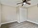 Bright bedroom with ceiling fan and double-door closet at 516 Highview N Cir, Brandon, FL 33510