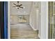 Bright and airy entryway with luxury vinyl plank flooring and ceiling fan at 516 Highview N Cir, Brandon, FL 33510