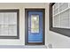 Inviting front entrance with blue door and windows at 516 Highview N Cir, Brandon, FL 33510