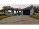 Modern home with gray exterior, black accents, and a two-car garage at 516 Highview N Cir, Brandon, FL 33510