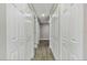 Clean hallway with neutral walls and wood-look floors at 516 Highview N Cir, Brandon, FL 33510