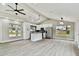 Modern kitchen featuring white cabinets, stainless steel appliances, and an island at 516 Highview N Cir, Brandon, FL 33510