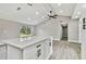 Modern kitchen island with white cabinets and quartz countertops at 516 Highview N Cir, Brandon, FL 33510