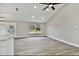 Bright and airy living area with vaulted ceiling and grey flooring at 516 Highview N Cir, Brandon, FL 33510