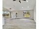 Bright living room with vaulted ceilings, new flooring, and sliding glass doors at 516 Highview N Cir, Brandon, FL 33510