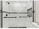 Large walk-in shower with marble and hexagon tile at 516 Highview N Cir, Brandon, FL 33510