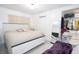 King-size bed, walk-in closet, and large mirror in bright bedroom at 5481 65Th N Ave, Pinellas Park, FL 33781